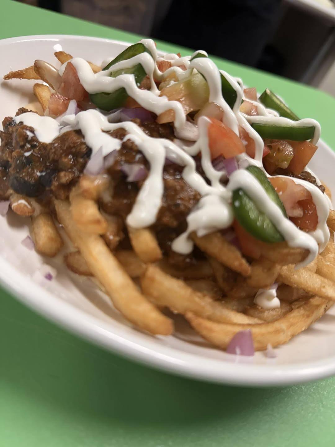 Loaded fries with chili, pico, jalapeños, and sour cream
